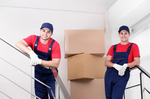 Local Shepherdsbush removal team planning a home move with furniture and packing supplies