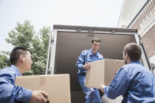 Furniture and boxes being carefully transported during a local West London move