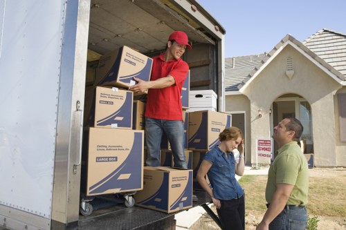 Packed moving boxes and furniture ready for collection