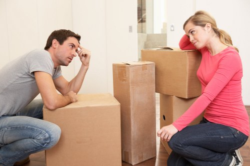 Worker handling boxed items with caution