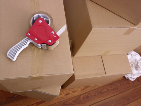 Packed boxes and furniture ready for transport in Shepherds Bush