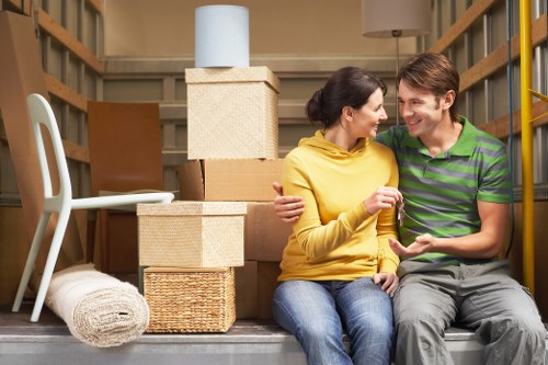 Packed boxes and furniture ready for local removals in Shepherds Bush